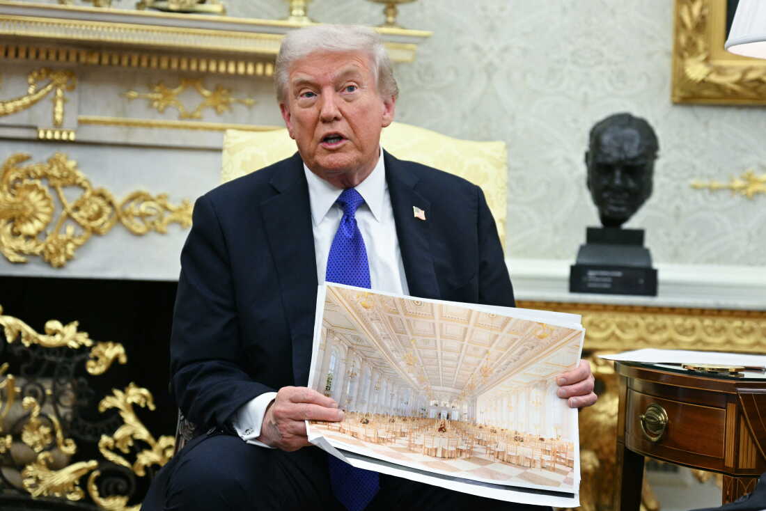 President Trump shows an image of his planned ballroom in the Oval Office on Oct. 22, 2025.