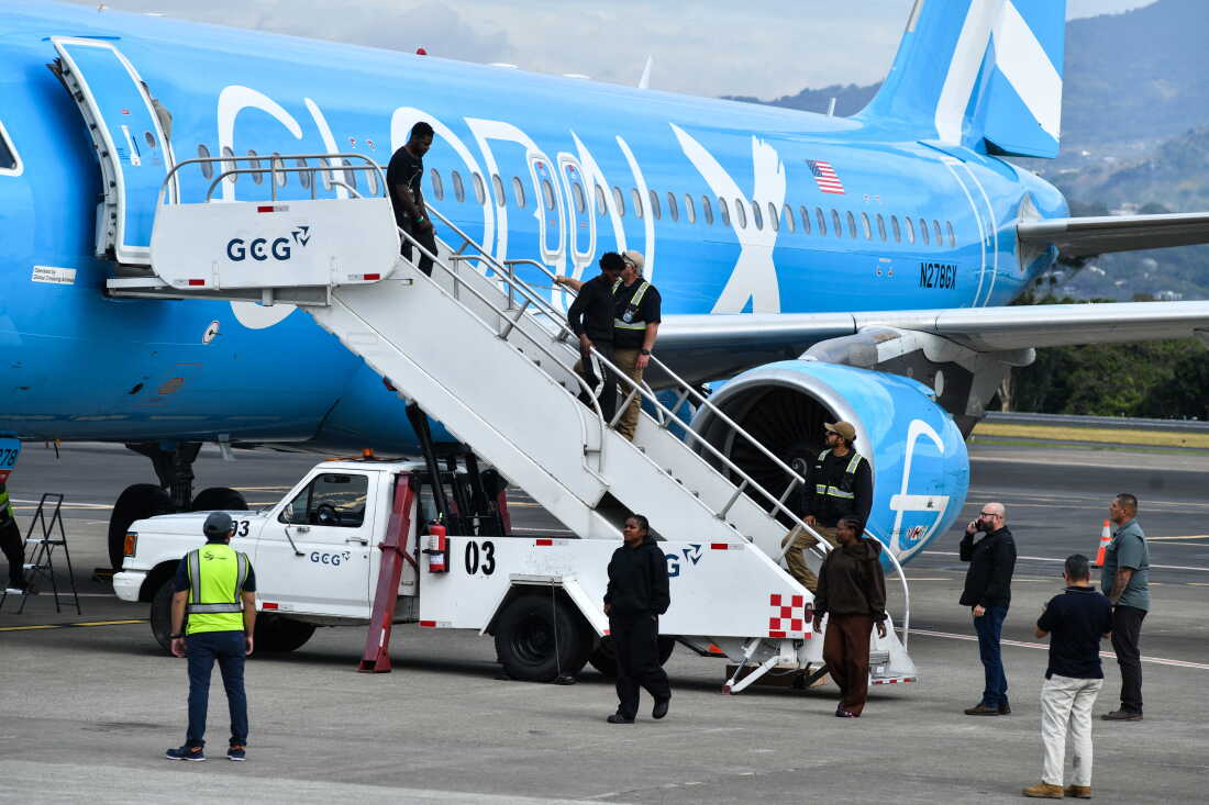 Migrants deported from the U.S. get off an airliner at the runway of the Juan Santamaria International Airport in Alajuela, Costa Rica in April 2026.