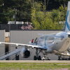 Detainees board a plane chartered by U.S. Immigration and Customs Enforcement (ICE) at King County International Airport on April 15, 2025 in Seattle, Washington. Semi-regular flights carrying detainees pass through the airport as the Trump administration continues to plan for the expansion of immigrant detention and deportation.
