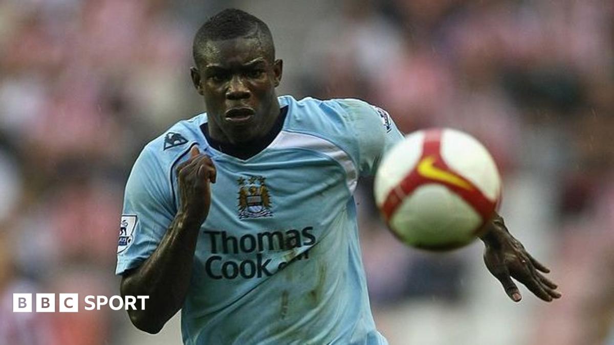 Micah Richards celebrates with members of the Manchester City staff after Sergio Aguero's goal against Queens Park Rangers in 2012