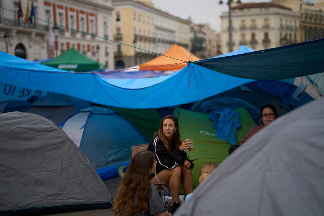 Demonstrators camp during a protest at Sol Square following the eviction last Wednesday of 87-year-old Maricarmen as they demand stronger laws to protect renters in Madrid, Spain, Monday, Sept. 28, 2026.