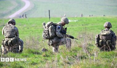 Soldiers from 16 Air Assault Brigade are seen after parachuting from a British Royal Air Force A400M transport aircraft onto Salisbury Plain at Copehill Down training facility in March 2026 as part of Joint Airborne Task Force (JATF) training launched from RAF Brize Norton.