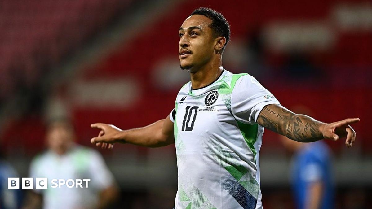 Forward Adam Idah celebrates with his arms outstretched after scoring for the Republic of Ireland against Israel