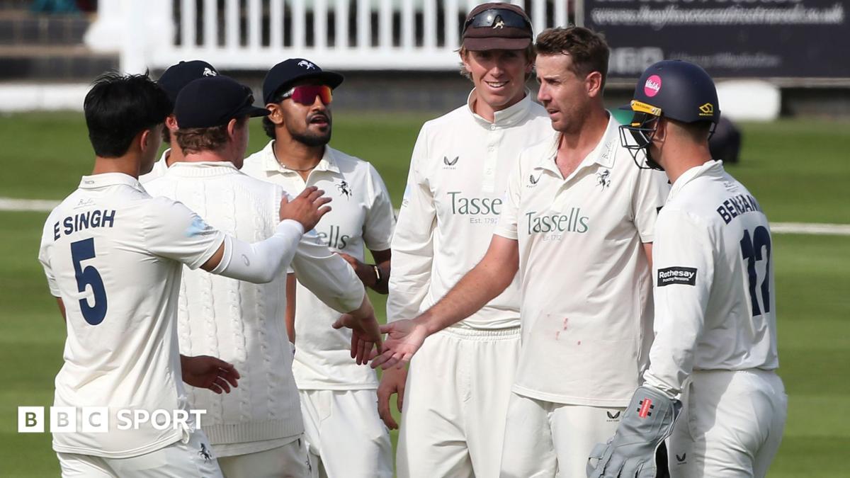 Kent players celebrate after taking a wicket