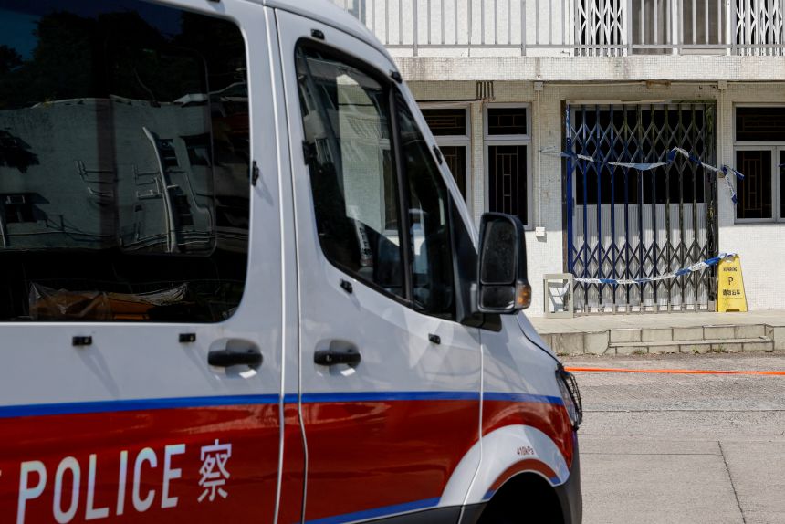 A police van is seen outside a village house where part of Abby Choi's body was found in Hong Kong, on February 27, 2023.