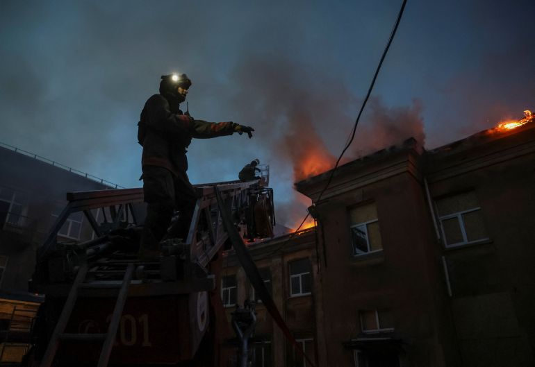 Firefighters work at a site of a building of an outpatient clinic hit by a Russian drone, amid Russia’s attack on Ukraine, in the front-line city of Kramatorsk in the Donetsk region, Ukraine, on August 30