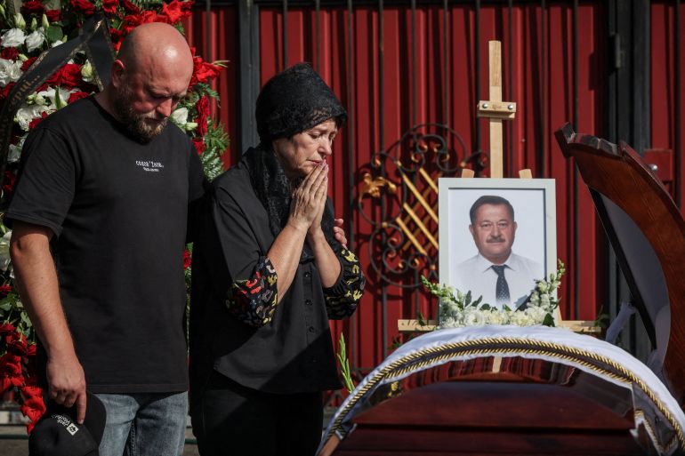 Family members attend the funeral of local villages’ community head Taras Didych, who was among 38 people killed in a Russian drone strike on the village of Myla on August 28, amid Russia's attack on Ukraine, in the village of Dmytrivka, Kyiv region, Ukraine August 31, 2026. REUTERS/Alina Smutko TPX IMAGES OF THE DAY