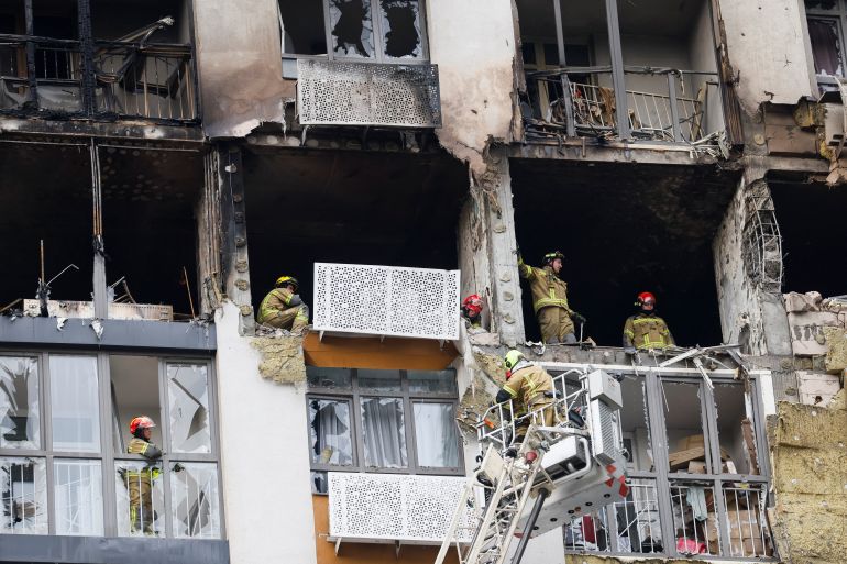 Firefighters work at the site of an apartment building damaged by a Russian drone strike, amid Russia’s attack on Ukraine, in Kyiv, Ukraine, on September 1