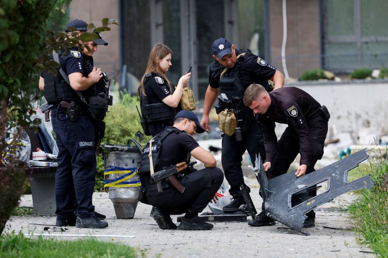 Police officers inspect parts of a Russian drone, at the site of an apartment building damaged by a Russian drone strike, amid Russia's attack on Ukraine, in Kyiv, Ukraine September 1, 2026. REUTERS/Gleb Garanich TPX IMAGES OF THE DAY