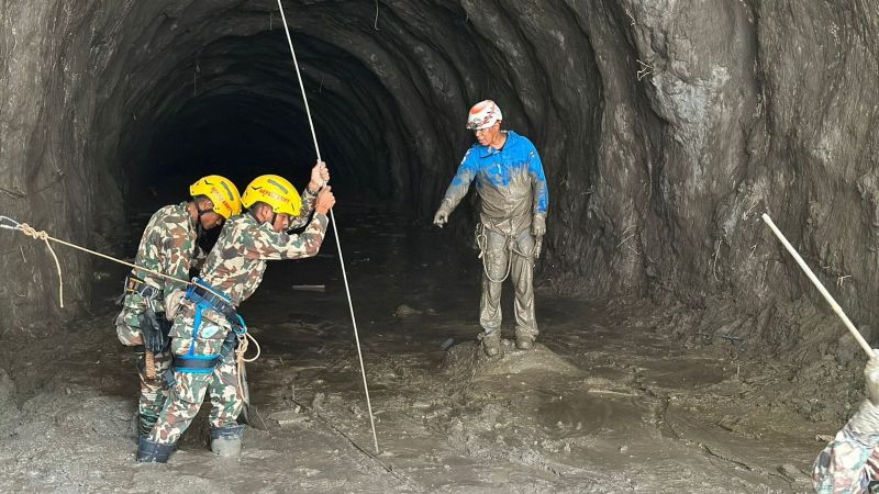 Two men rescued from flood-stricken Nepali power plant where scores trapped
