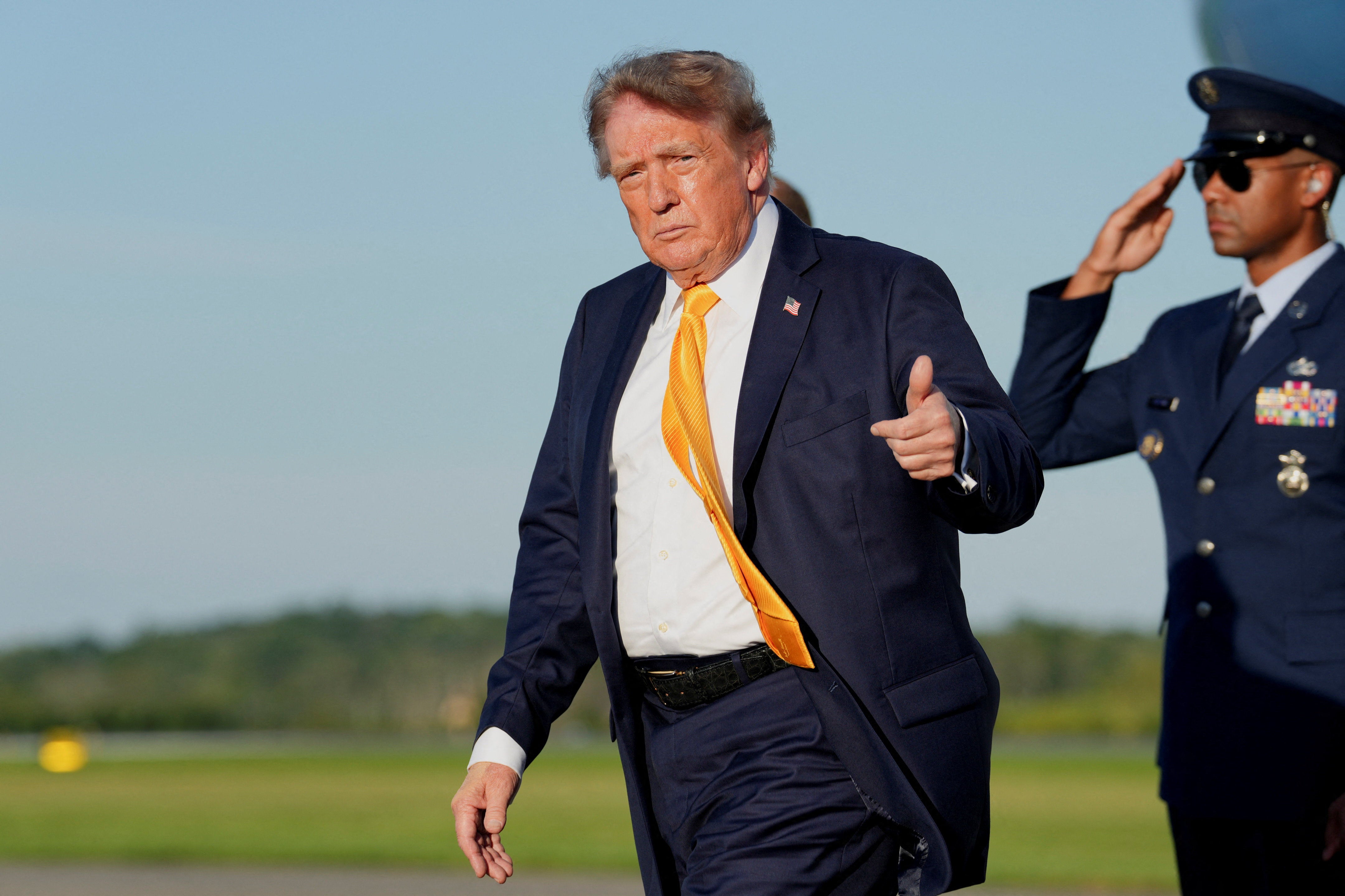 Photos of President Donald Trump stepping off Air Force One with hair that appears to be a darker shade than his signature blonde locks have puzzled the internet