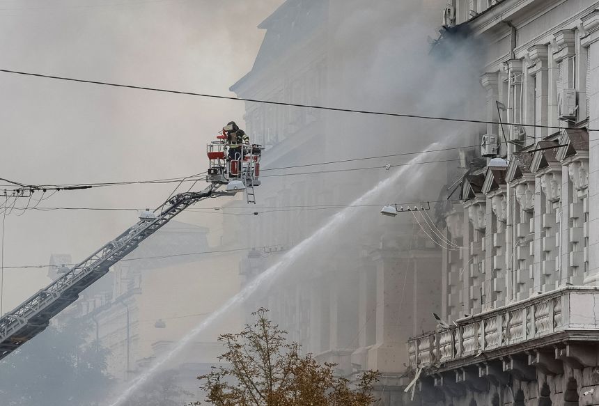A firefighter works at the site of Ukraine's SBU security service after a Russian drone strike on Friday.