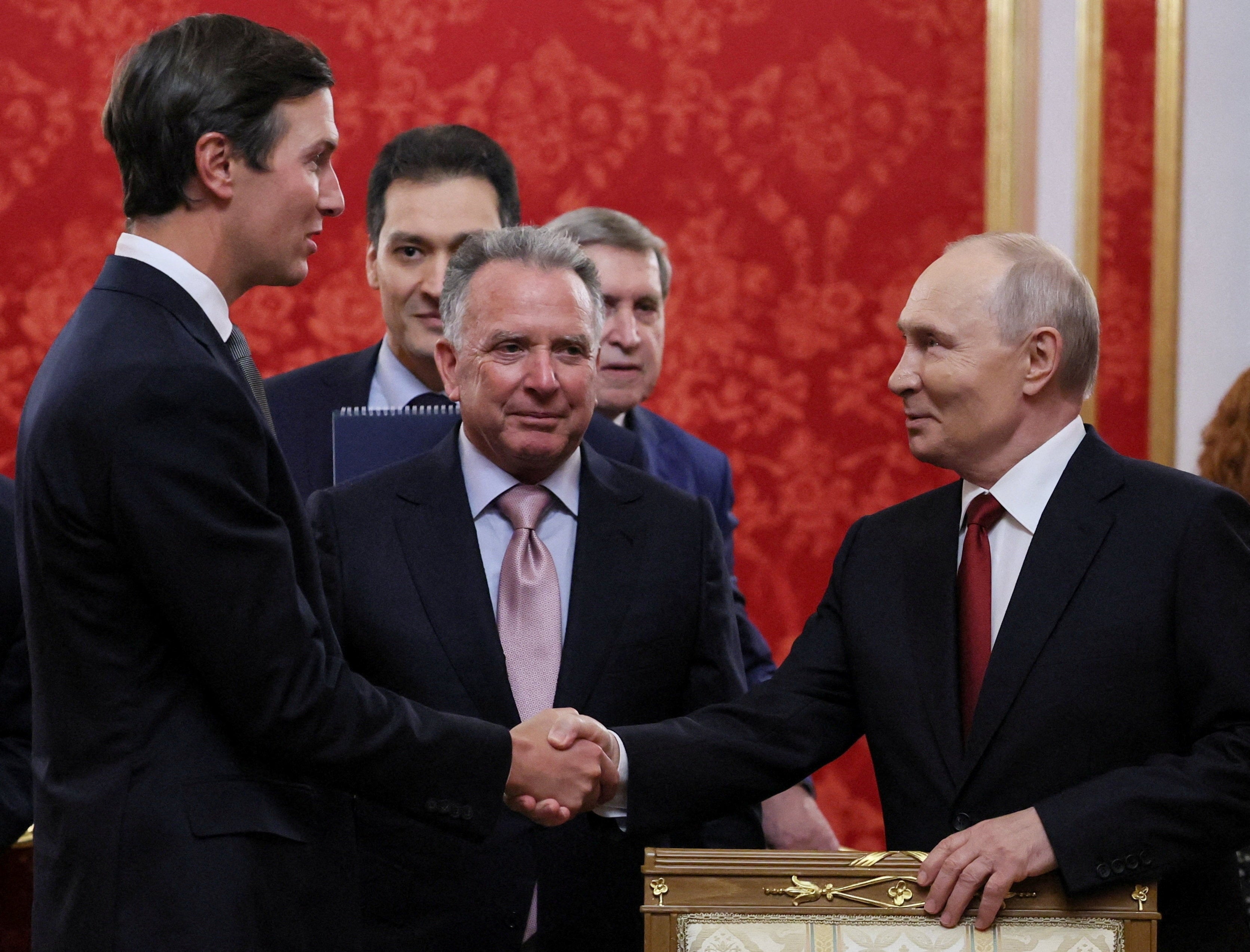 Russian President Vladimir Putin shakes hands with Jared Kushner, U.S. President Donald Trump's son-in-law