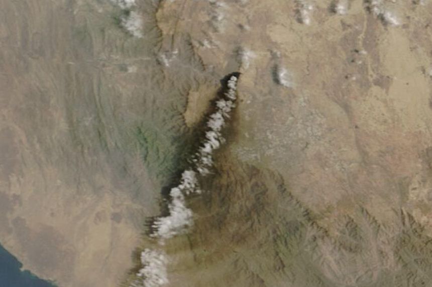A satellite image shows smoke rising from the Saudi Aramco distribution centre, after what the Saudi-led coalition in Yemen said were attacks by Yemen's Iran-aligned Houthis, in Abha Bulk, Saudi Arabia, in this handout image obtained by Reuters on September 8, 2026.
