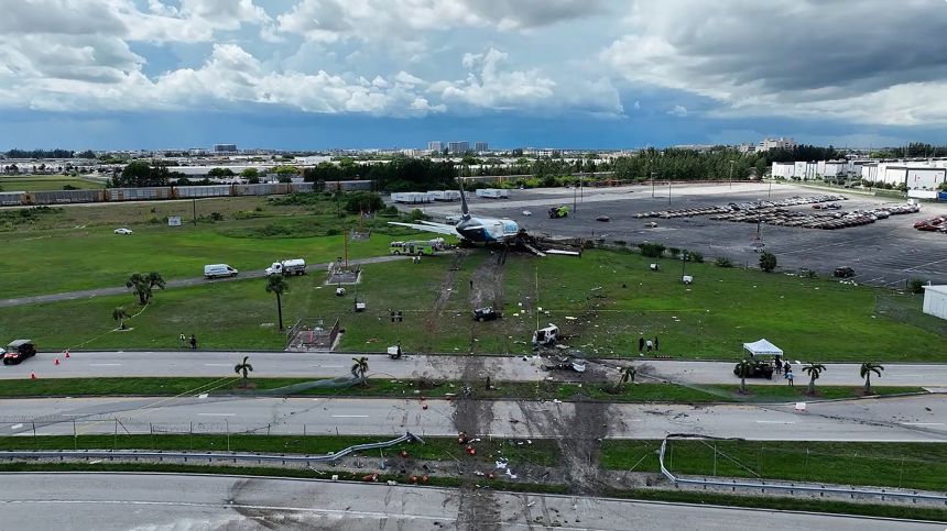 Drone footage shows skid marks from an Amazon cargo plane that careened off a runway at Miami International Airport.