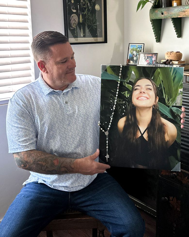 Brian Dalton shows his daughter’s portrait at his home in Boise, Idaho, on September 11, 2026.