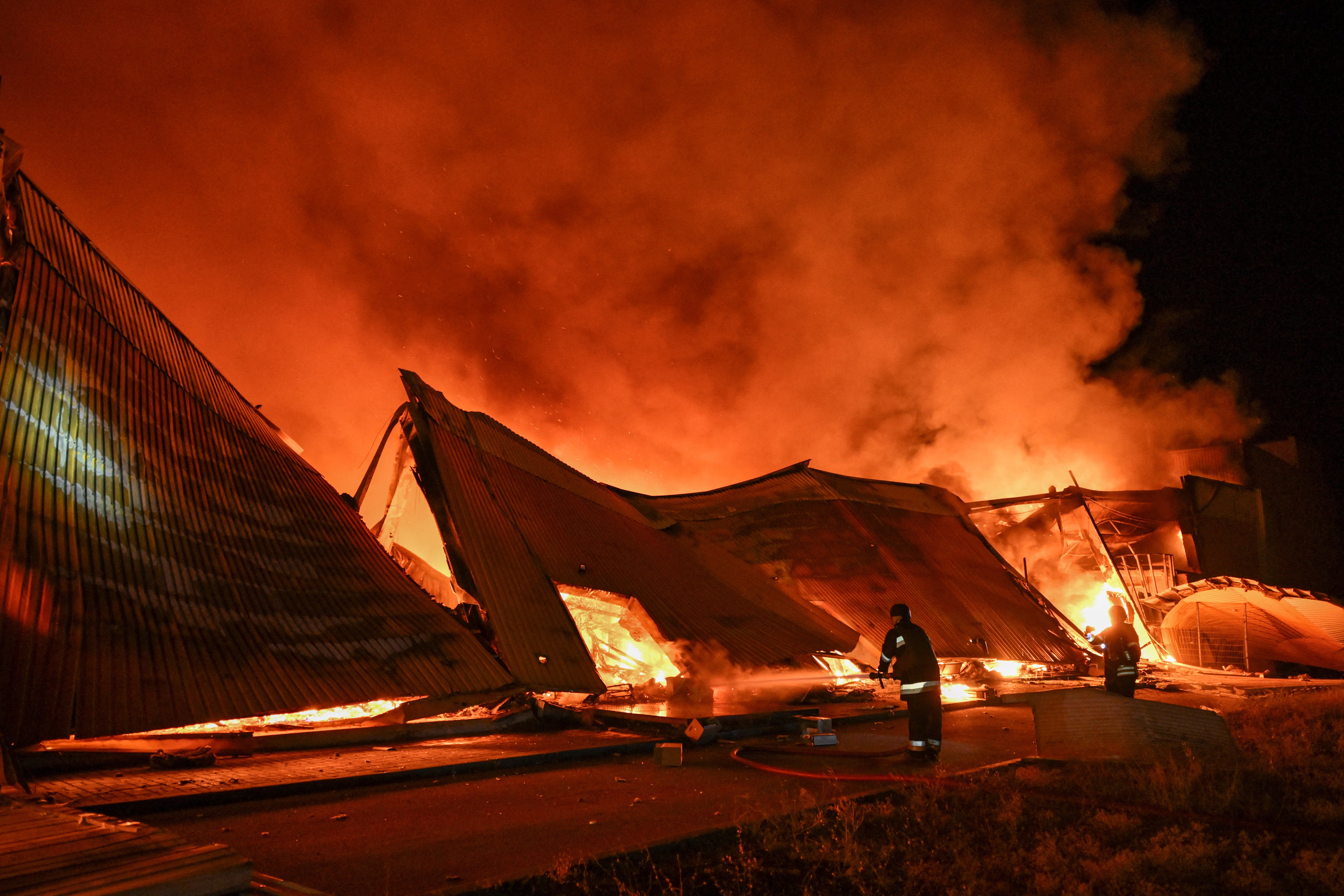Fire crews battled a major fire at the site of the strike in Zaporizhzhia, Ukraine