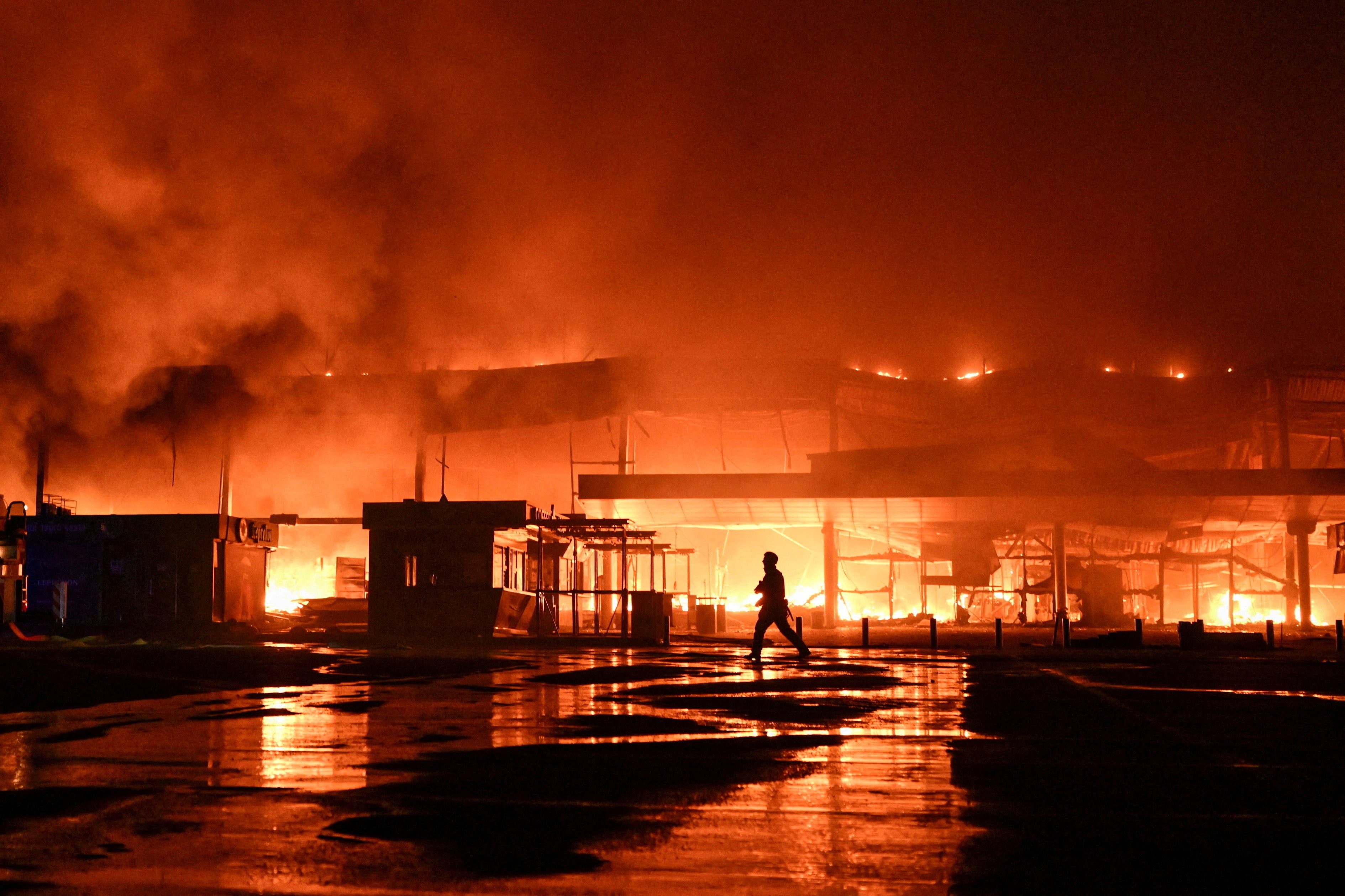 A firefighter works at the site of a shopping mall which was hit by a late evening Russian drone strike in Zaporizhzhia, Ukraine September 17, 2026