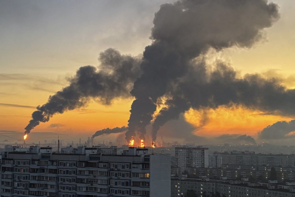 Plumes of smoke rise from fires (centre) at an oil refinery following what the authorities say is a Ukrainian drone strike...