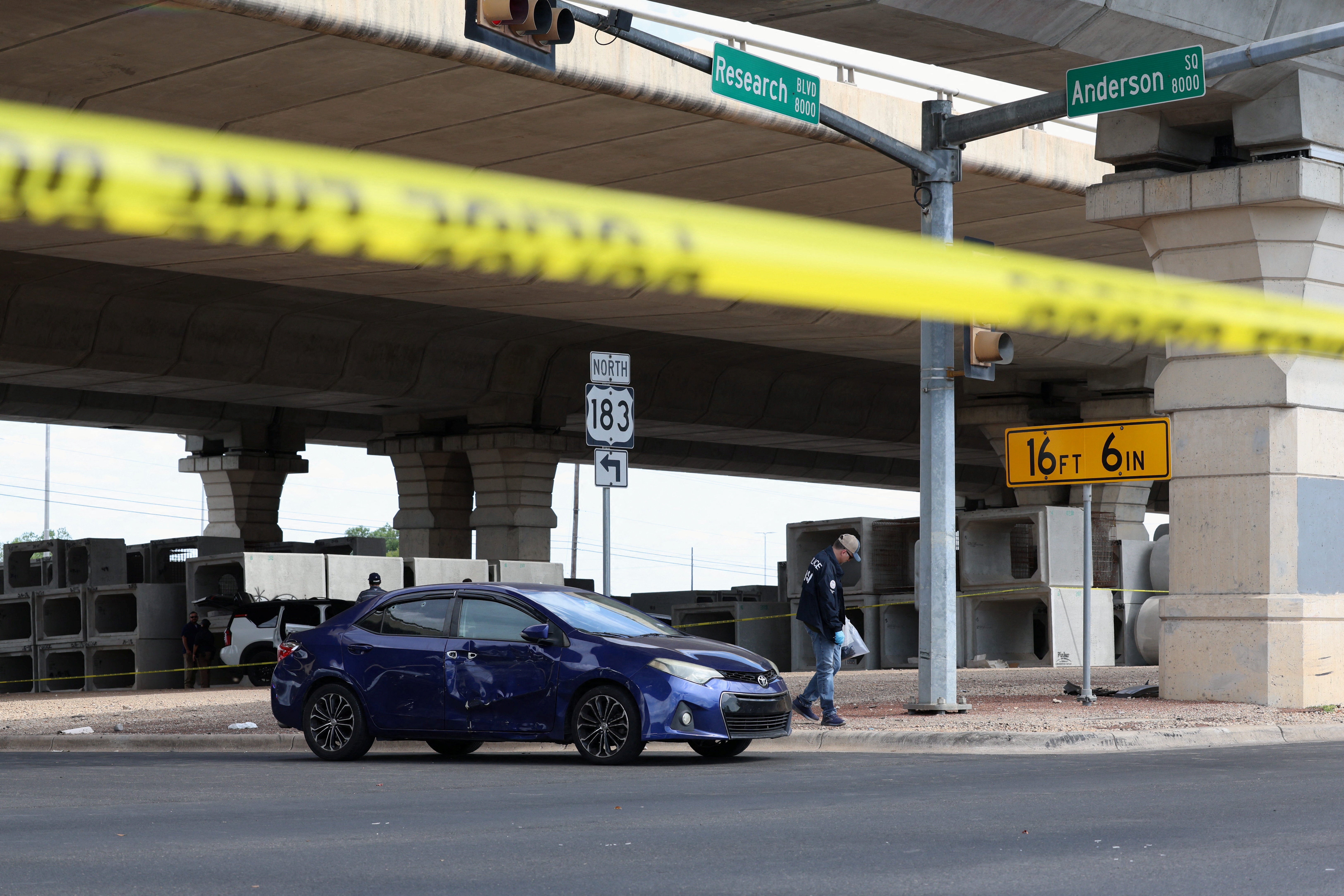 A car at the scene of the shooting in Austin, Texas, appears to have bullet holes in it