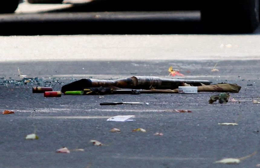 A shotgun and shotgun shells lie on the ground at the scene of the shooting in Belleville, Ontario, Canada, September 21.