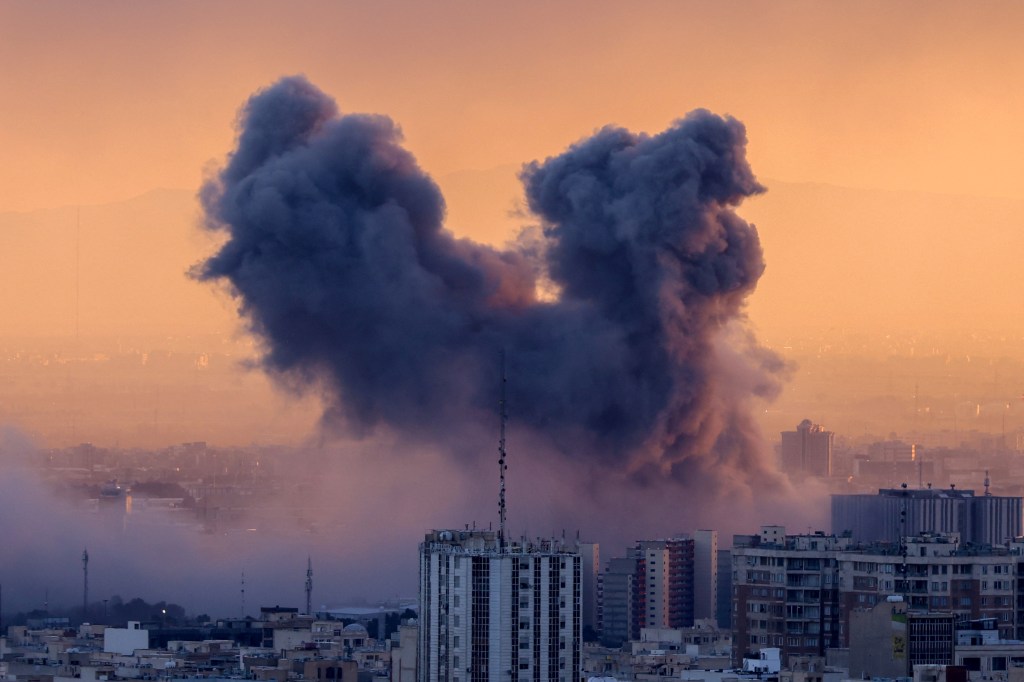 A plume of smoke rising after a strike on the Iranian capital, Tehran.