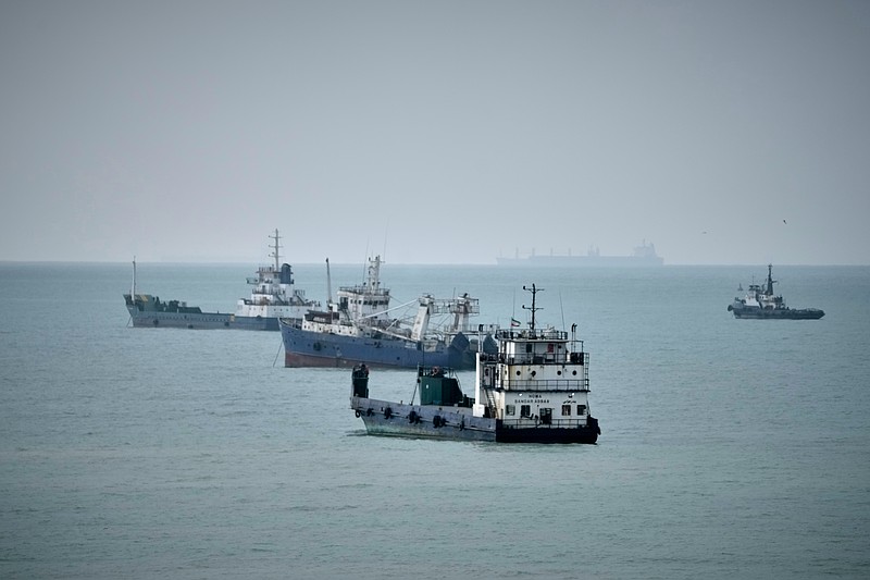 Commercial vessels lie anchored in the Strait of Hormuz off Bandar Abbas, Iran, Friday, Sept. 4, 2026. (AP Photo/Vahid Salemi)