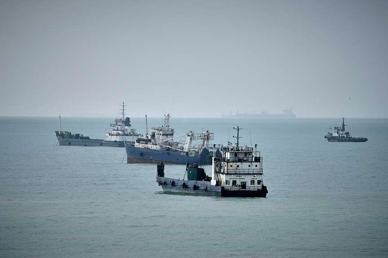 Commercial vessels lie anchored in the Strait of Hormuz off Bandar Abbas, Iran, Friday, Sept. 4, 2026. (AP Photo/Vahid Salemi)