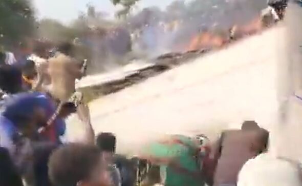 Eyewitnesses at the site of the wreckage watch on in horror