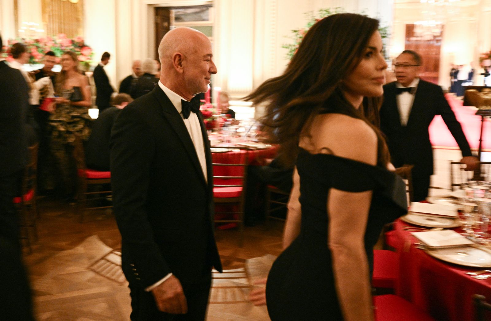 Amazon's founder Jeff Bezos and his wife Lauren Sanchez Bezos attend a state dinner hosted by President Donald Trump for...