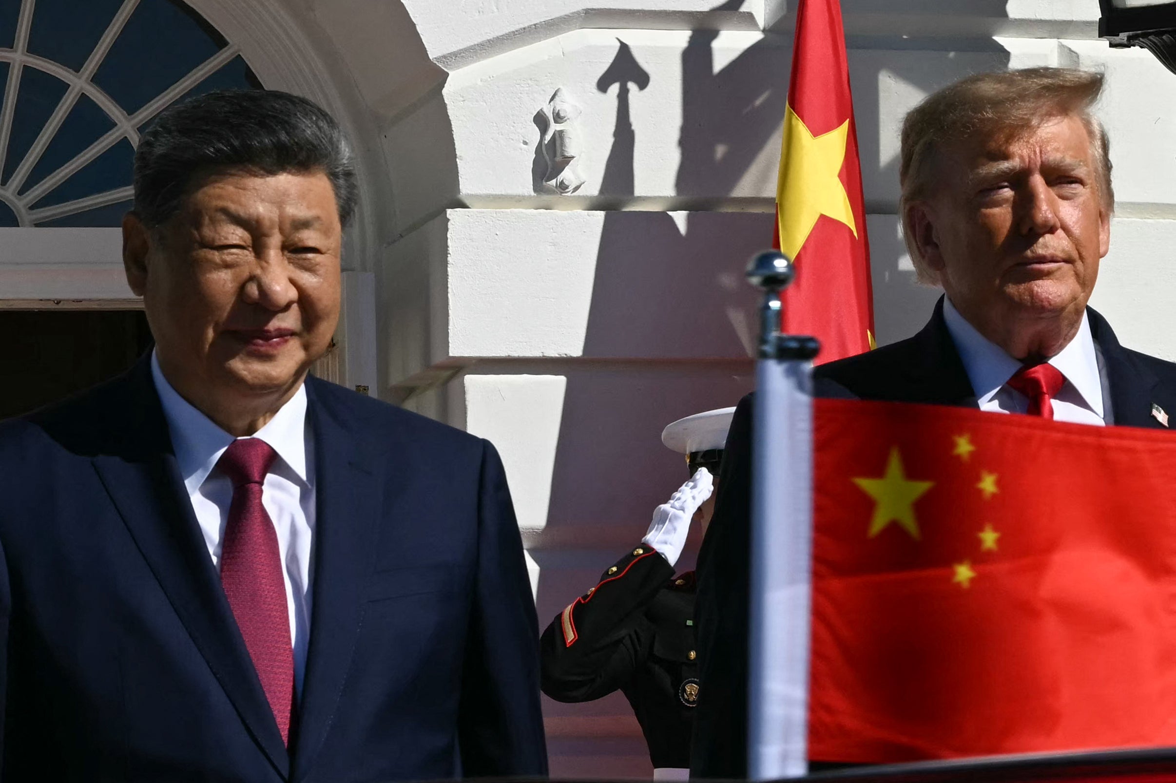 President Donald Trump stands alongside China's President Xi Jinping upon Xi's arrival at the South Portico of the White House, in Washington, DC, on September 25, 2026. President Trump and First Lady Melania Trump are hosting China's President Xi Jinping and his wife Peng Liyuan for tea.
