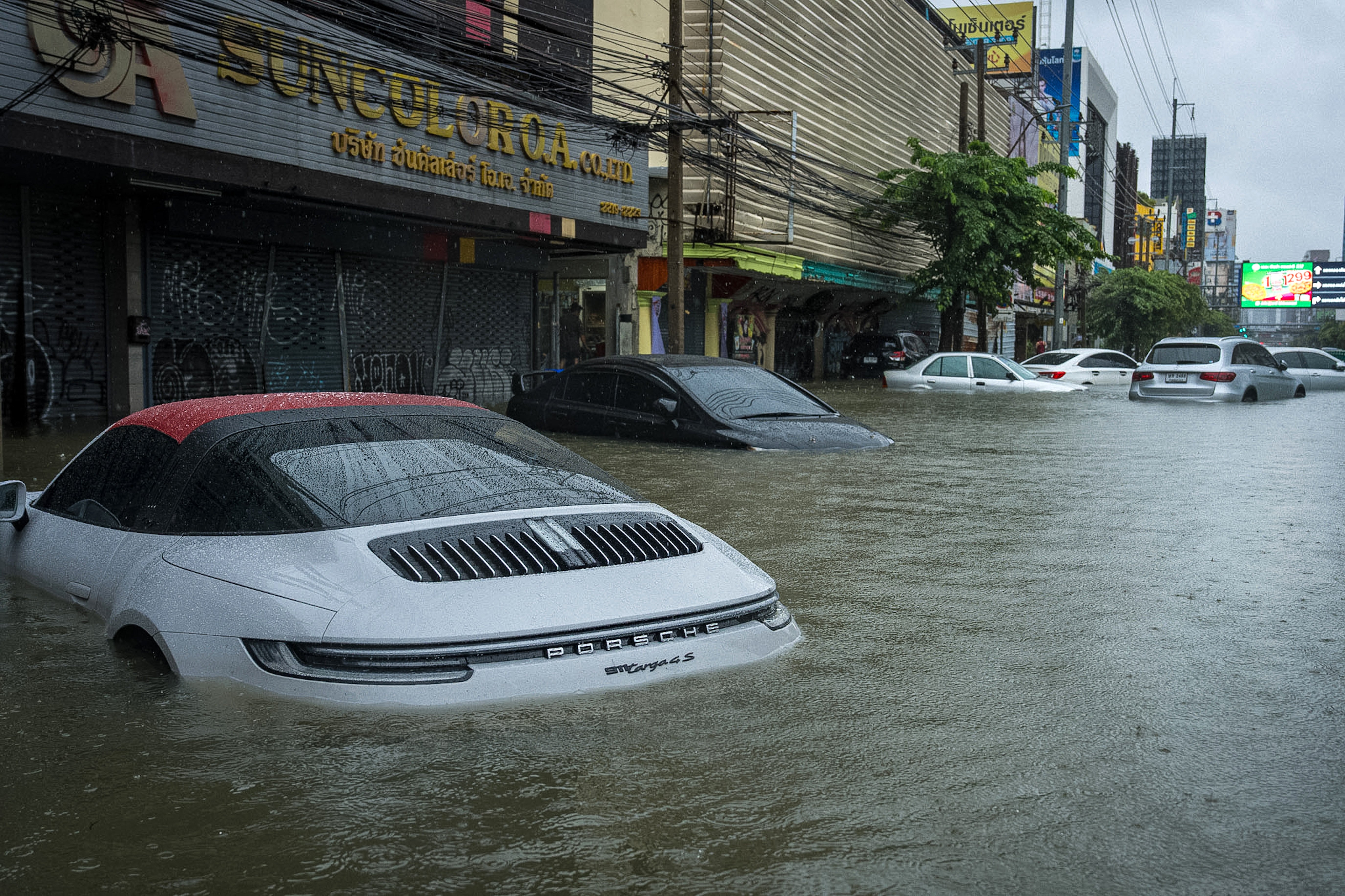 Cars are submerged in flood waters after heavy rain in Bangkok on 26 September, 2026