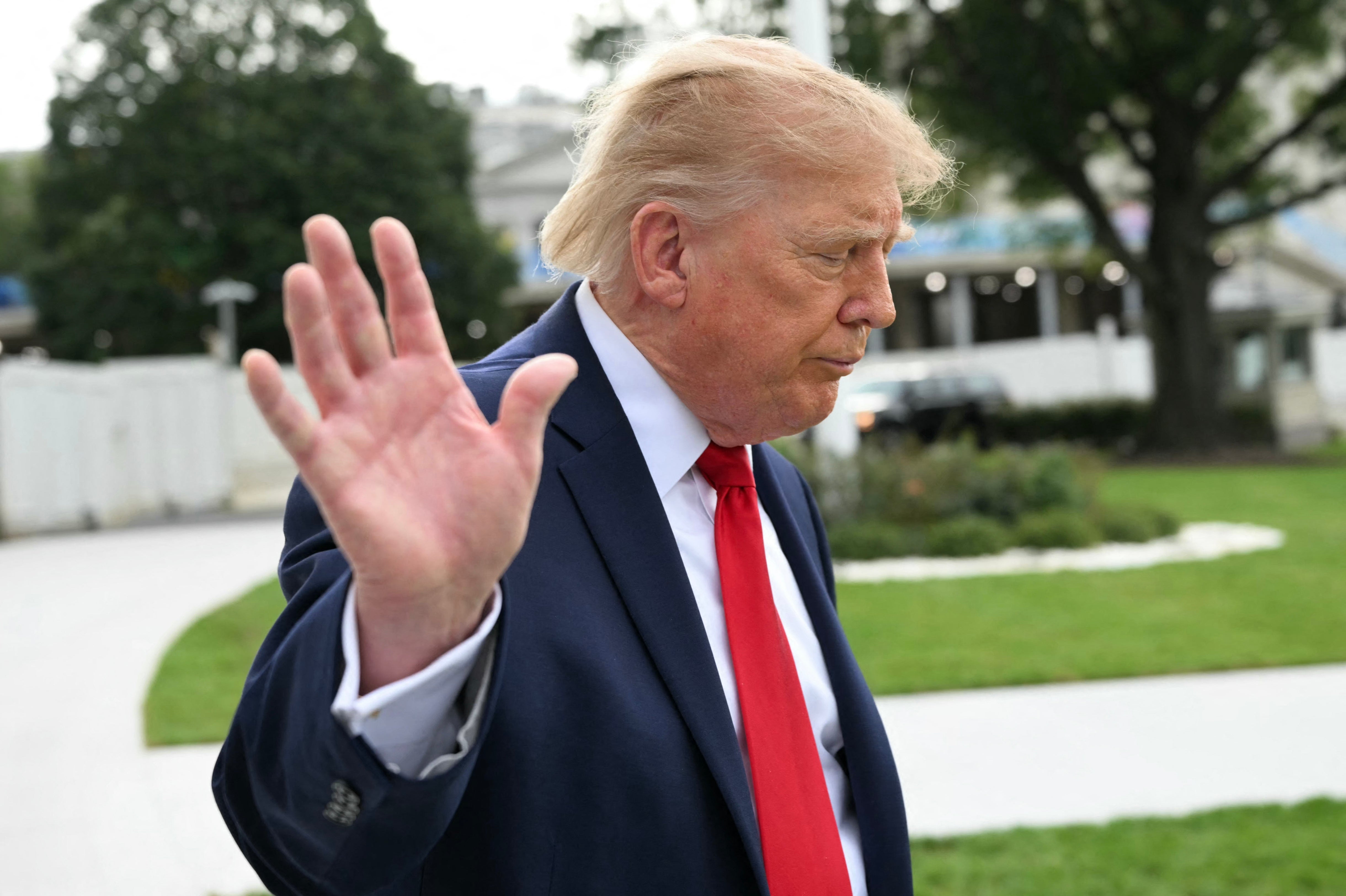 President Donald Trump waves as he walks to board Marine One as he departs from the South Lawn of the White House in Washington, DC, on September 26. US President Donald Trump is heading to Knoxville, Tennessee to attend the Tennessee/Texas college football game
