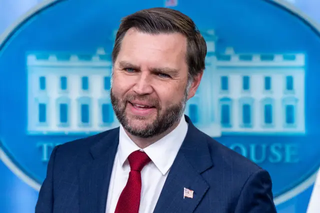 JD Vance smiles at the White House press briefing