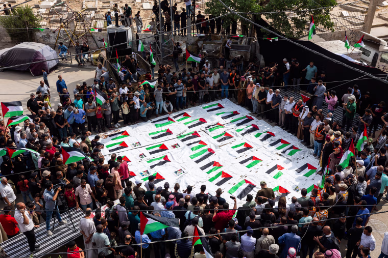 Mass funeral for Palestinians recovered from rubble of destroyed buildings in Gaza
