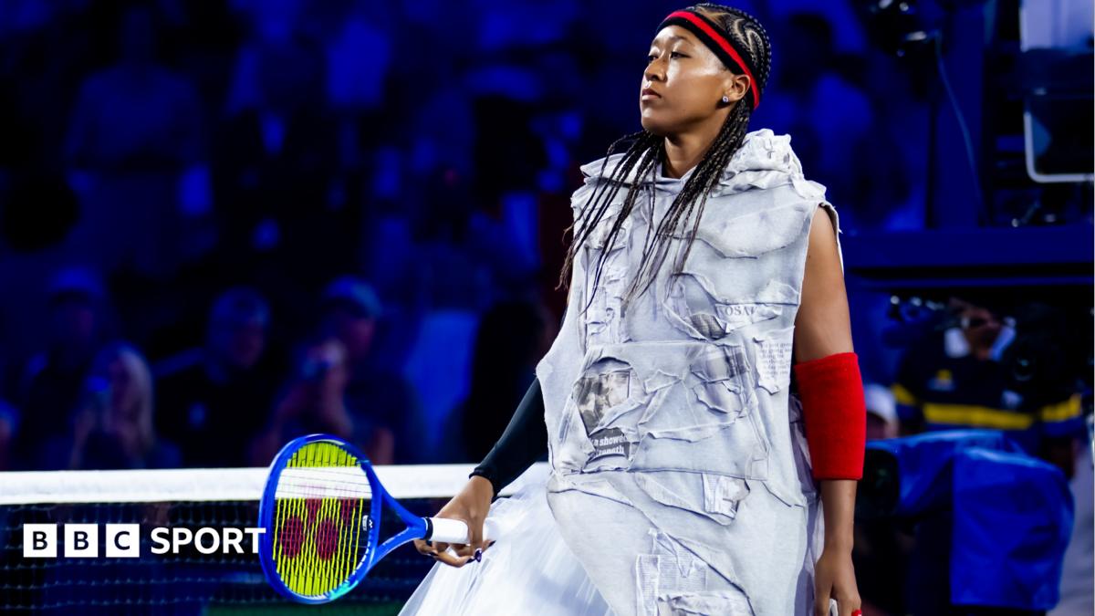 Naomi Osaka wears a red-and-black headband and elbow sleeves similar to those worn by Allen Iverson