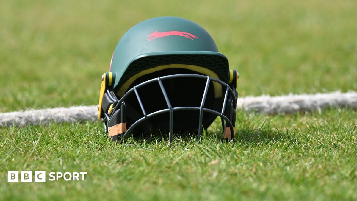 A green Leicestershire helmet placed by a boundary rope