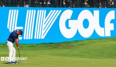 Golfer Bryson DeChambeau putts in front of a big blue and white LIV Golf sign