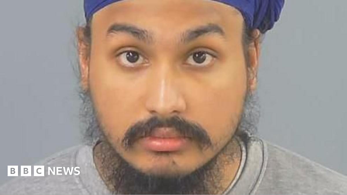 Custody photograph of Vickrum Digwa wearing a turban and grey sweatshirt.