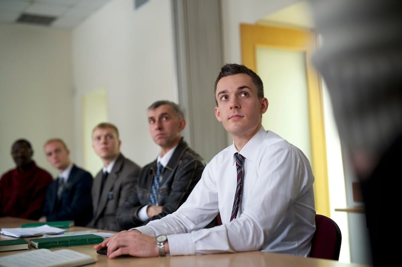 A group of men attend priesthood quorum meetings in Ukraine.