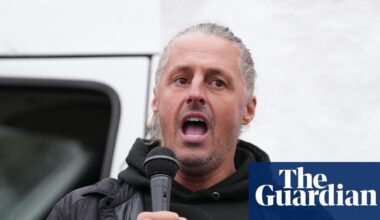 Leader of group behind flag campaign in England charged with 14 offences | UK news