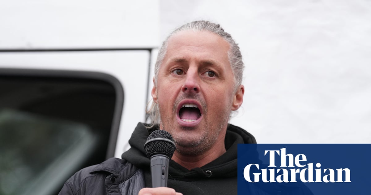 Leader of group behind flag campaign in England charged with 14 offences | UK news