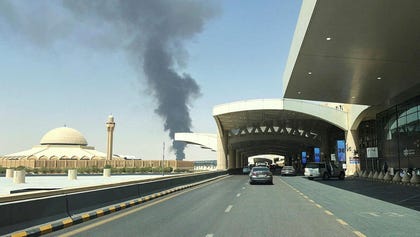 Large plume of black smoke rises from the fuel storage area at King Khalid International Airport, in Riyadh, Saudi Arabia, Saturday. Credit: Stringer/ REUTERS Large plume of black smoke rises from the fuel storage area at King Khalid International Airport, in Riyadh, Saudi Arabia, Saturday.