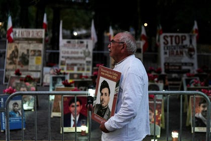 A man holds a photo and a lantern as Iranian Americans hold a candlelight vigil against the Iranian leadership outside the United Nations headquarters in New York City, US, September 19, 2026. REUTERS/David 'Dee' Delgado. Credit: David Dee Delgado/ REUTERS A man holds a photo and a lantern as Iranian Americans hold a candlelight vigil against the Iranian leadership outside the United Nations headquarters in New York City, US, September 19, 2026. REUTERS/David 'Dee' Delgado
