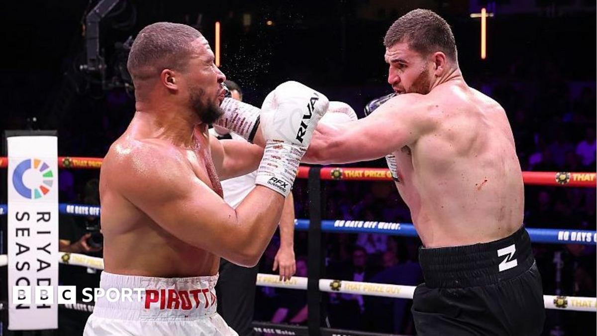 Johnny Fisher lands a punch on Michael Pirotton