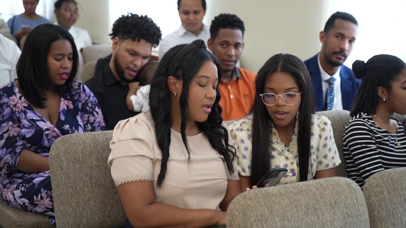 Members of a congregation in the Dominican Republic sing selections from “Hymns for Home and Church” during their sacrament meeting.
