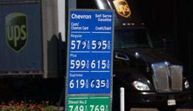 The United Parcel Service Inc. (UPS) logo is seen on a semi-truck as it drives past Chevron diesel prices above $7 a gallon at a gas station in Vernon, California on Aug. 26, 2026. The US and Iran are approaching the six-month mark since military operations began on Feb. 28, 2026, with the two nations remaining entrenched in a strategic stalemate. President Trump has intensified pressure through an aggressive economic isolation campaign, while a 60-day ceasefire and diplomatic window expired without producing a lasting agreement. The conflict's most significant impact on the US economy is the rise in energy costs, which is contributing to higher inflation.
