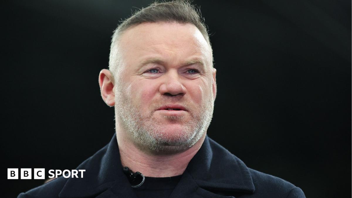 Former Manchester United striker Wayne Rooney looks on