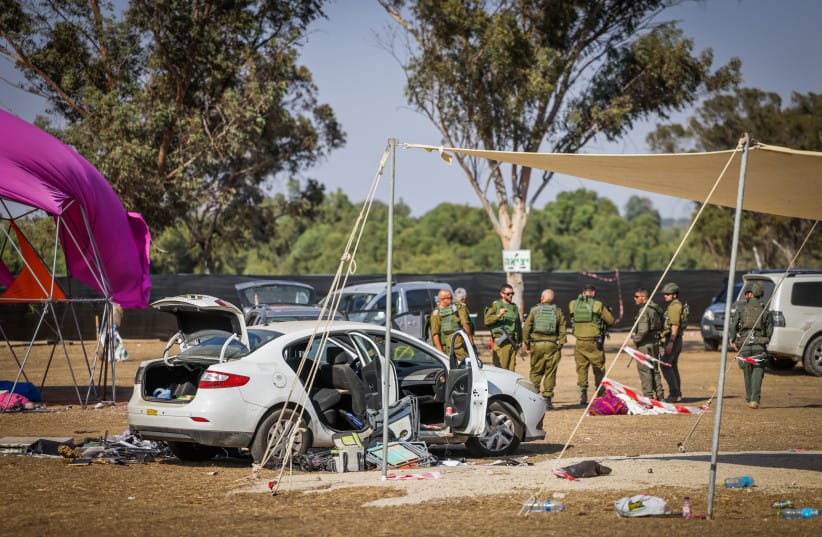 IDF soldiers seen in the aftermath of Hamas's Nova music festival massacre in Re'im, southern Israel, on October 7, 2023.
