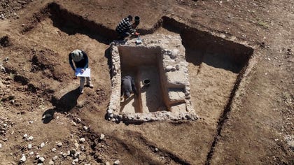 To protect the ancient plaster coating the walls, the conservators applied gauze and adhesives to the ancient stones.